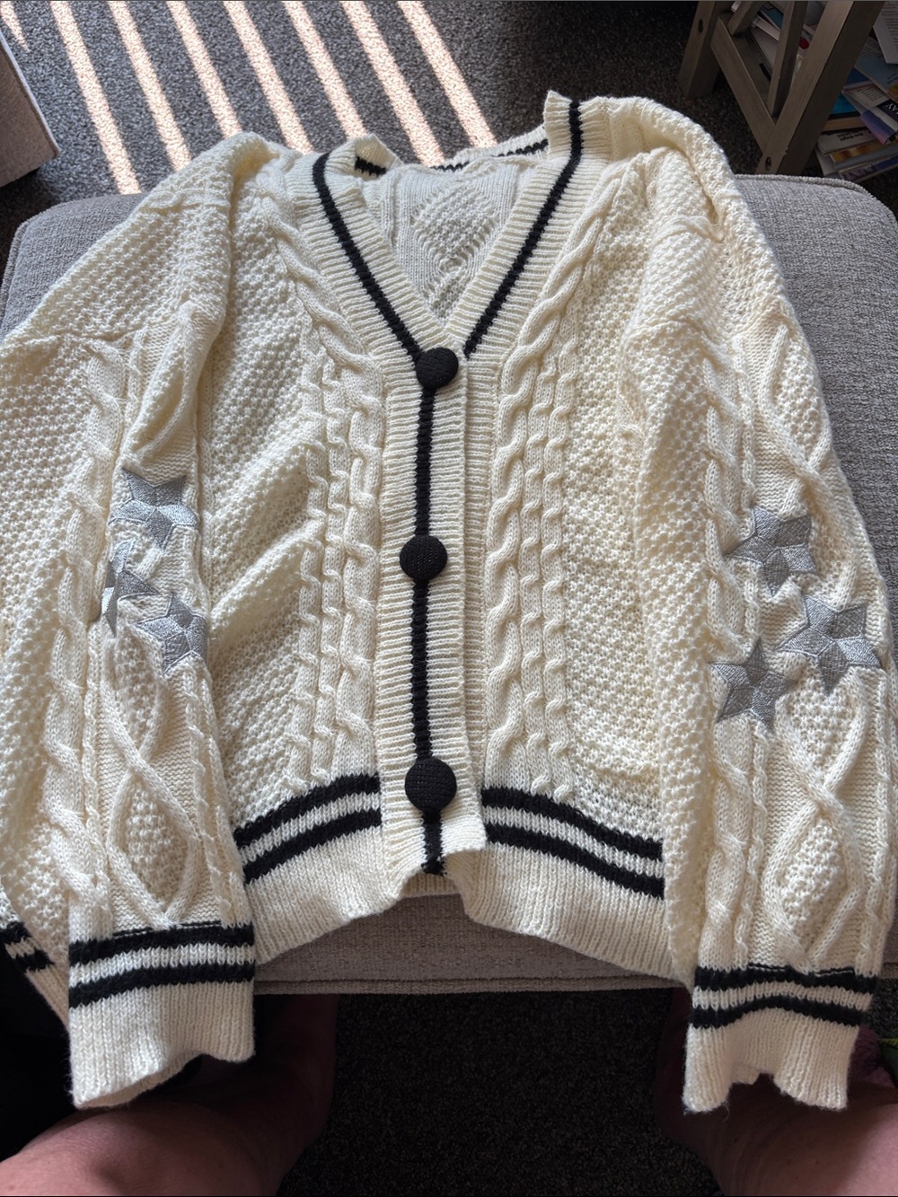 Cream Cable-Knit Cardigan with Black Trim and Star Elbow Detail